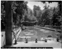Maria Louisa Park, view down a long, rectangular pool, Seville, Spain, 1929