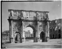 Arch of Constantine, view from the south with the Colosseum in the background, Rome, Italy, 1929