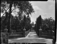 Gardens at Alcázar of Seville, view of benches framing a circular space, Seville, Spain, 1929