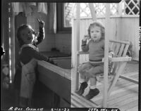 Two pictures of two-year-old Rosita Dee Cornell by a sink and in a chair-swing, California, 1933