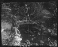 Two Estes children fishing in a lily pond, [Van Nuys?], between 1928 and 1936