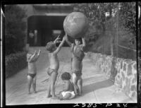 Five Estes children playing with exercise ball in a yard, [Van Nuys?], between 1928 and 1936