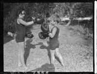 Two Estes children with boxing gloves in a yard, [Van Nuys?], between 1928 and 1936