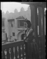 Woman in fringed shawl on balcony of the Hotel Playa Ensenada , Ensenada, 1931