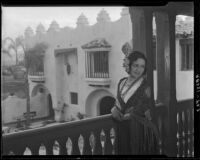 Woman in fringed shawl on balcony of the Hotel Playa Ensenada, Ensenada, 1931