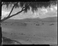 Harbor, boats, and pier with the Hotel Playa de Ensenada in the far distance, Ensenada, 1931