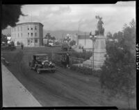 View of street in Ensenada with statue of Miguel Hidalgo, 1931