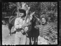 Sally Phipps, unidentified man, and horses, Lake Arrowhead, 1929