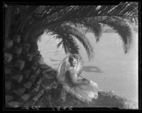 Virginia Pizzini, Miss Venice, under palm tree with parasol, [Venice?], 1929
