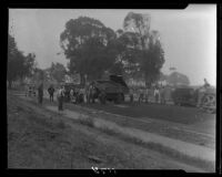 Asphalt trucks and workers on road under construction in Huntington Palisades, Pacific Palisades, 1929