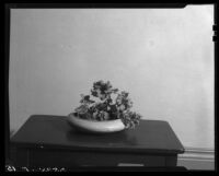 Japanese style flower arrangement  with a bowl filled with flowers on a table by Margaret Preininger, Los Angeles, 1935