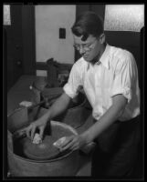 Los Angeles City College student with rock polishing wheel, Los Angeles, circa 1933-1938