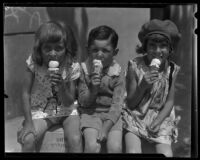 Three children eating ice cream cones from a concession at Abbot Kinney Pier, Venice, 1928