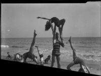 Children doing gymnastics on beach, Malibu, 1929
