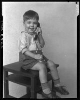 Boy with toy telephone, Los Angeles, circa 1935
