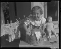 Girl doing doll's laundry, Los Angeles, circa 1935