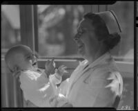 Baby and nurse, Los Angeles, circa 1935