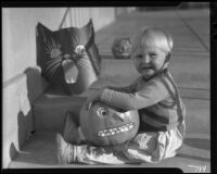 Child with Halloween decorations, [between 1933 and 1939?]