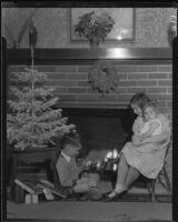 Children at fireplace with Christmas decorations, Los Angeles, circa 1935