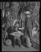 Boys with corn and pumpkins, Los Angeles, circa 1935