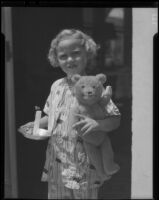 Girl with teddy bear and candle, Los Angeles, circa 1935