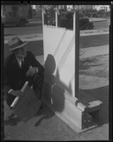Man with blueprint and steel home section, [1930s?]