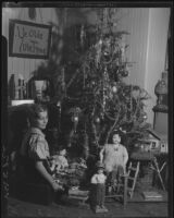 Girl and Christmas tree, [Santa Monica, 1929]