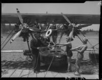 Group on dock and on Sikorsky S38-A "The Flying Fish" amphibian plane on water, Lake Arrowhead, 1929