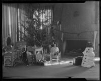 Christmas tree, fireplace, toys, and cotton snowman, Santa Monica, 1925