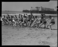 Tug-of-war game on beach, Santa Monica, 1938