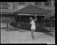 Swimmer Helene Madison with surfboard at Grand Hotel, Santa Monica, 1933
