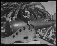 Woman seated on Civil War cannon, Palisades Park, Santa Monica, [1930s?]