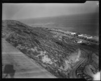Coastal view towards road construction on a slope in the Rancho Malibu la Costa development, Malibu, circa 1927