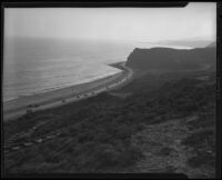 Coastal view down slope towards road construction in the Rancho Malibu la Costa development, Malibu, circa 1927