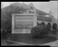 Spanish style house with signs in front advertising Rancho Malibu la Costa, Malibu, circa 1927