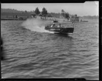 Outboard motorboat Ashbridge Flyer on lake, Lake Arrowhead, [1929?]