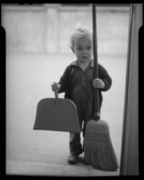 Child with broom and dustpan, Los Angeles, circa 1935