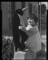 Girl with toy penguin, Los Angeles, circa 1935