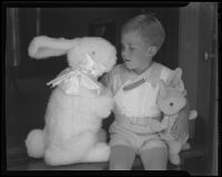 Boy with toy bunnies, Los Angeles, circa 1935