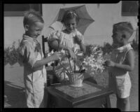 Children arranging Easter lilies, Los Angelse, circa 1935