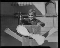 Boy in cardboard airplane, Los Angeles, circa 1935