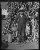 Boy with corn and pumpkins, Los Angeles, circa 1935