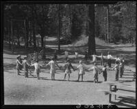Children hand in hand in ring, Lake Arrowhead, 1929