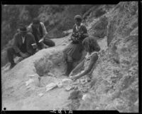 Men, woman, and girl with rocks on rocky hillside, near Magic Mountain, Ventura County, 1930