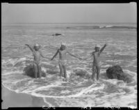 Mawby triplets wading in surf hand in hand, Malibu, 1928