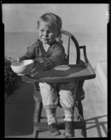 Child in highchair with bowl, Los Angeles, circa 1935