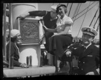 Alice Carter nailing plaque to mast, S.S. Constitution, San Diego Harbor, San Diego, 1934