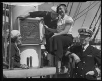 Alice Carter nailing plaque to mast, S.S. Constitution, San Diego Harbor, San Diego, 1934