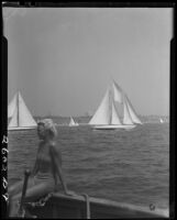 Woman in bathing suit on sailboat during Regatta Week, Santa Monica, 1934