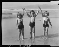 Patsy, Peggy, and Tommy Morgan posing on beach, Santa Monica, 1929